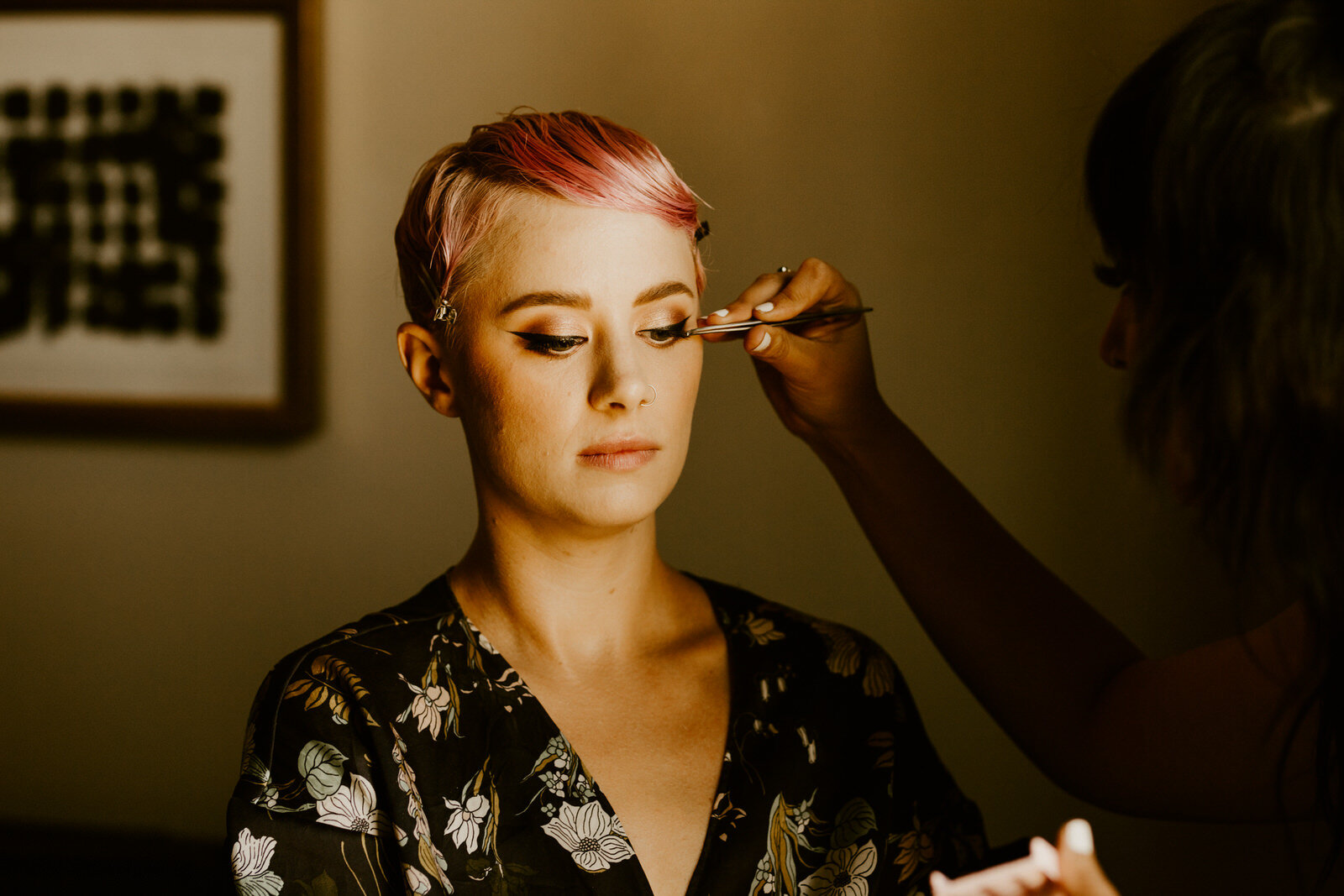 Bride with pink hair getting ready for modern, feminist wedding at Hotel Figueroa