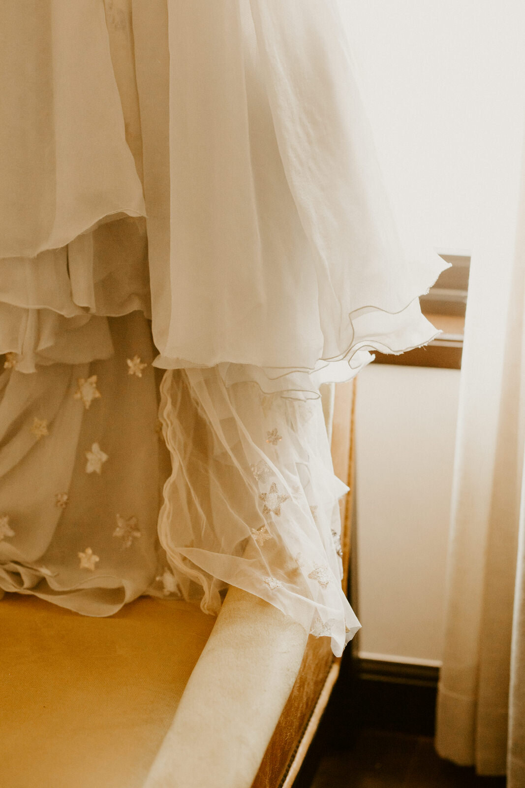 Close up of dress detail - sequin starred silver dress at modern, feminist wedding