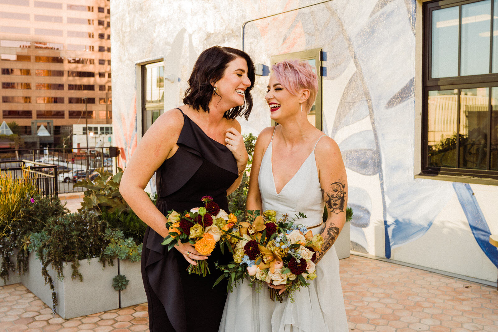 bride and friend laughing at Hotel Figueroa wedding