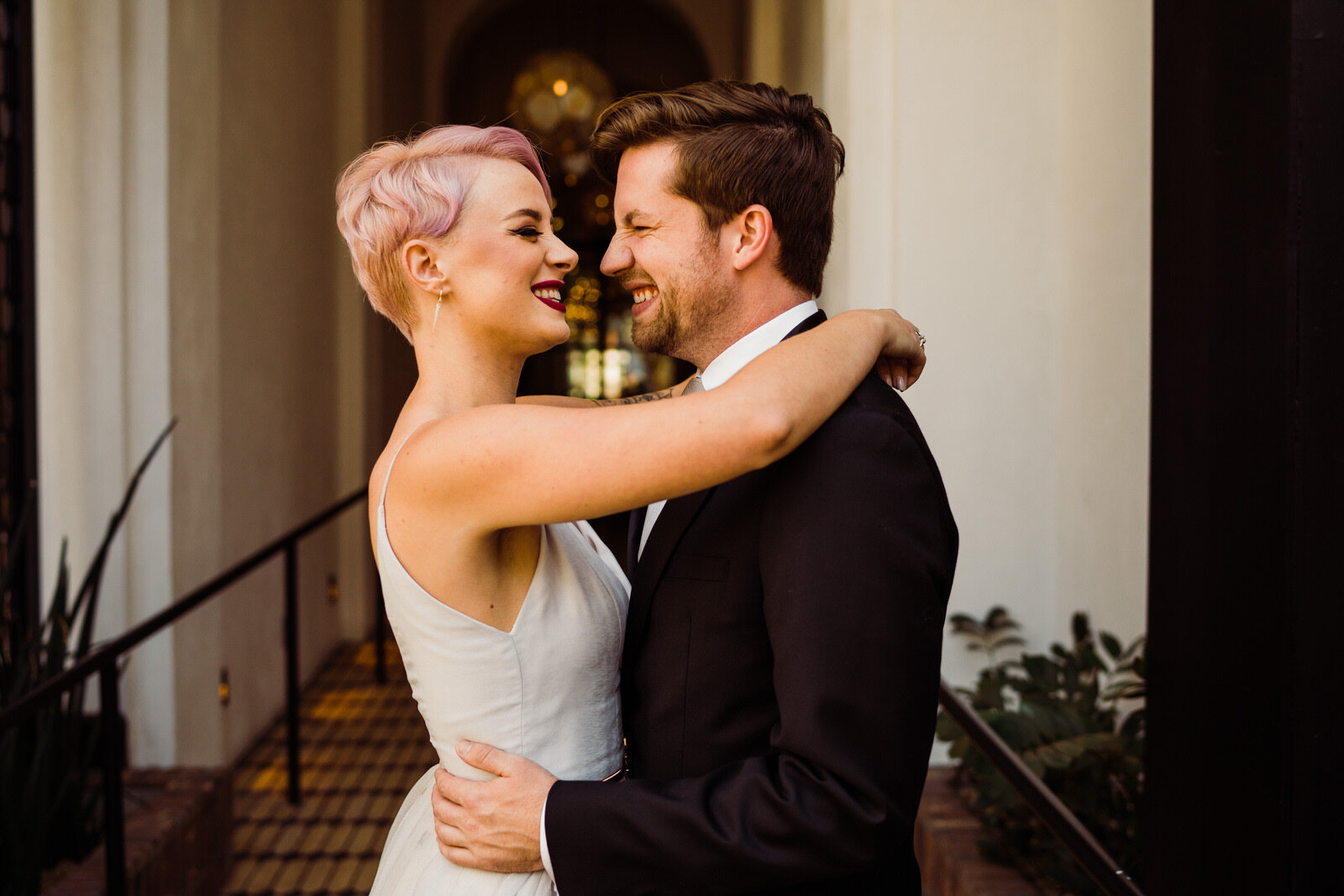 Cute photo of couple laughing at modern, feminist Hotel Figueroa wedding