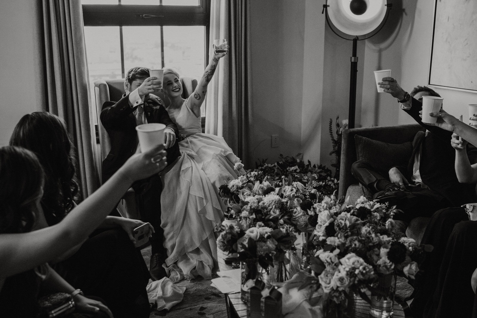 Co-ed wedding party takes a shot before ceremony at Hotel Figueroa