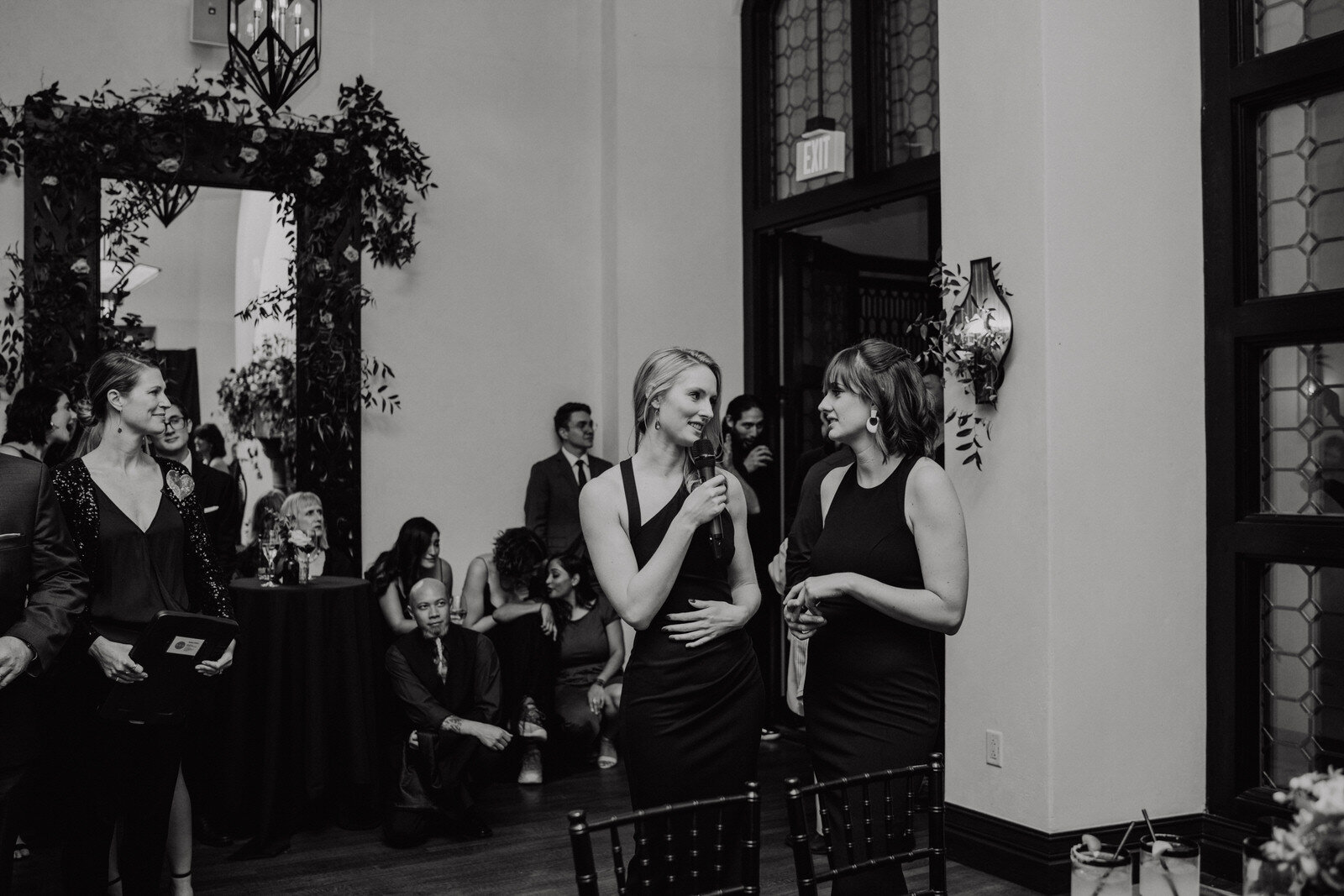 black and white photo of toasts in Gran Sala at Hotel Figueroa wedding reception