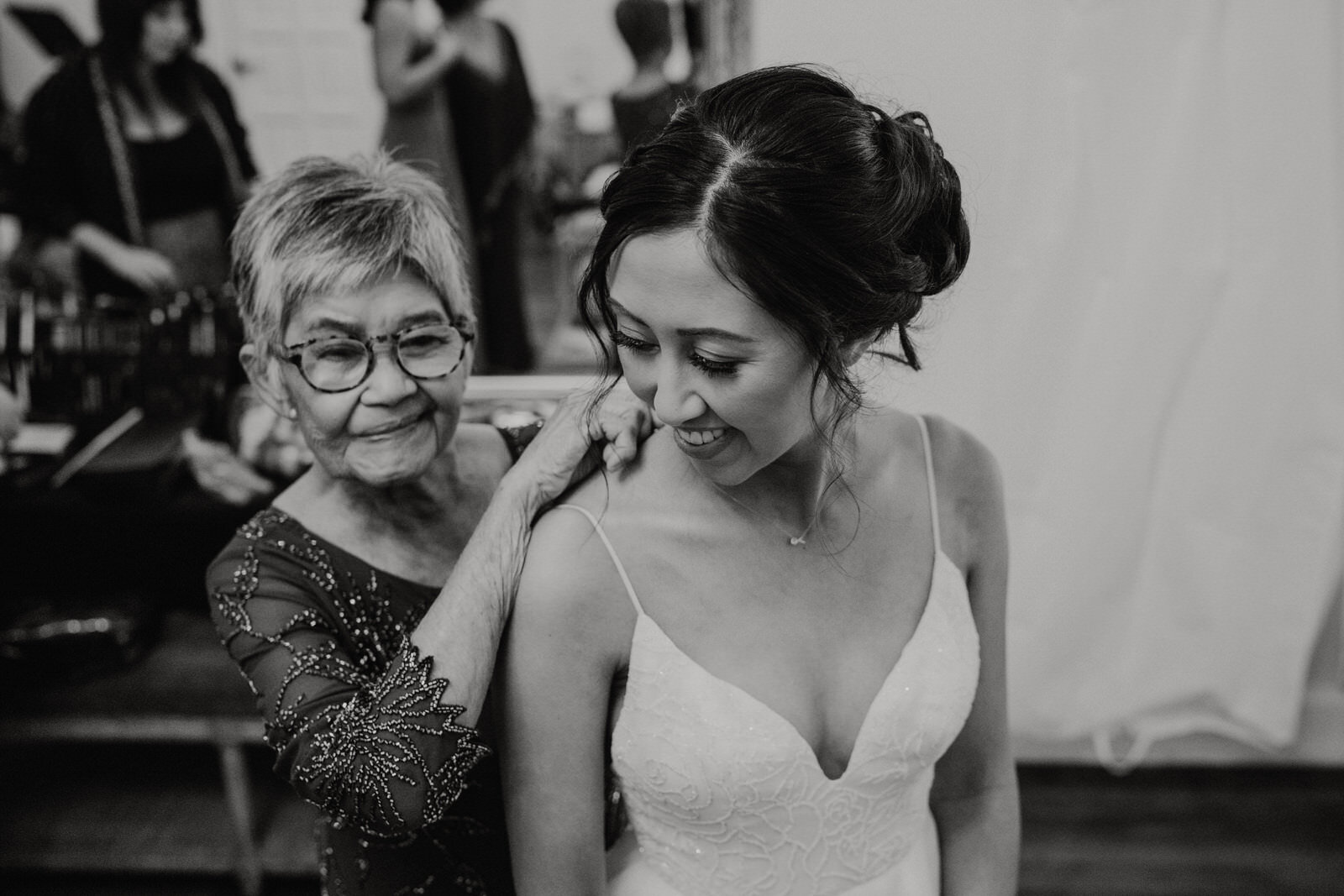 Candid photo of bride and grandmother at Franciscan Gardens wedding in San Juan Capistrano, CA by Kept Record www.keptrecord.com