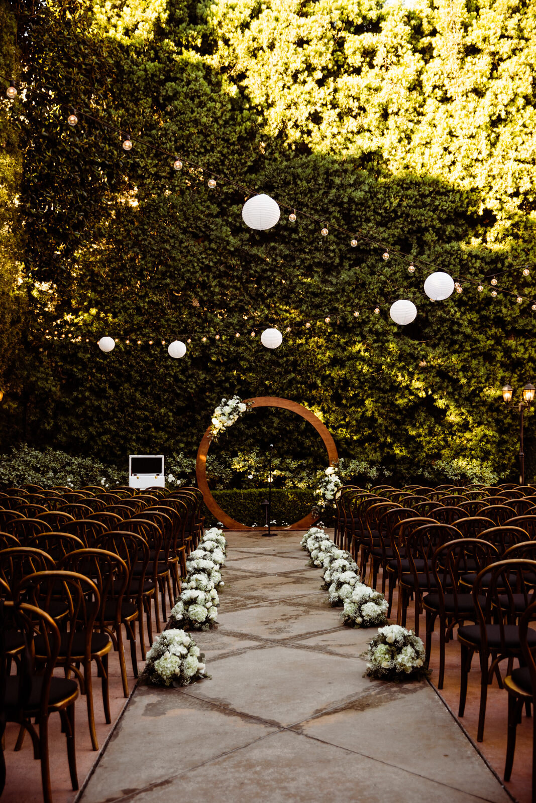 Ceremony space with wooden circle arch at Franciscan Gardens in San Juan Capistrano - Morgan Pirkle-Kept Record www.keptrecord.com