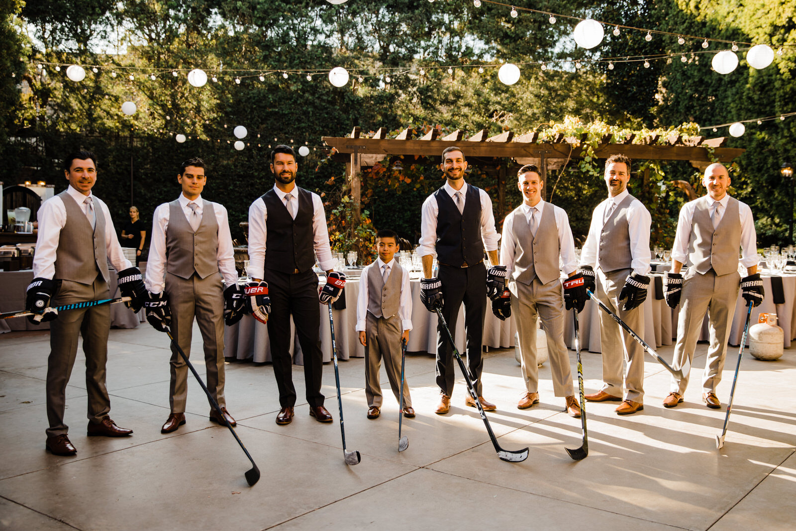 Candid, warm wedding photography | Groom and Groomsmen with Hockey Sticks | Franciscan Gardens wedding in San Juan Capistrano, CA by Kept Record www.keptrecord.com