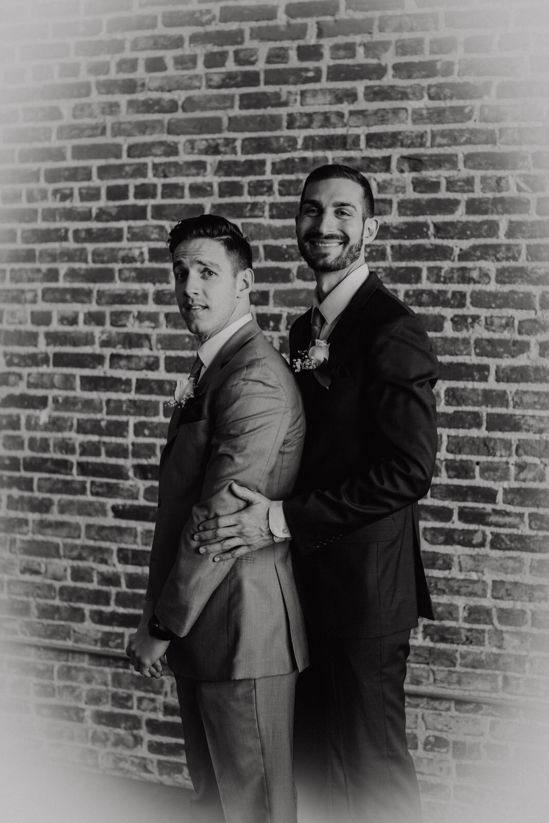 Groom and groomsman take silly prom reenactment photo | Candid, warm wedding photography | Franciscan Gardens wedding in San Juan Capistrano, CA by Kept Record www.keptrecord.com