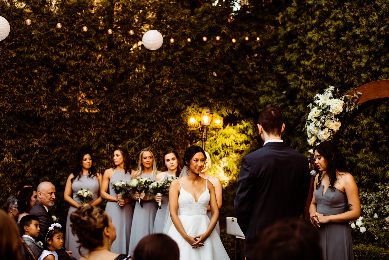 Bride and groom exchange vows | Candid, warm wedding photography | Franciscan Gardens wedding in San Juan Capistrano, CA by Kept Record www.keptrecord.com