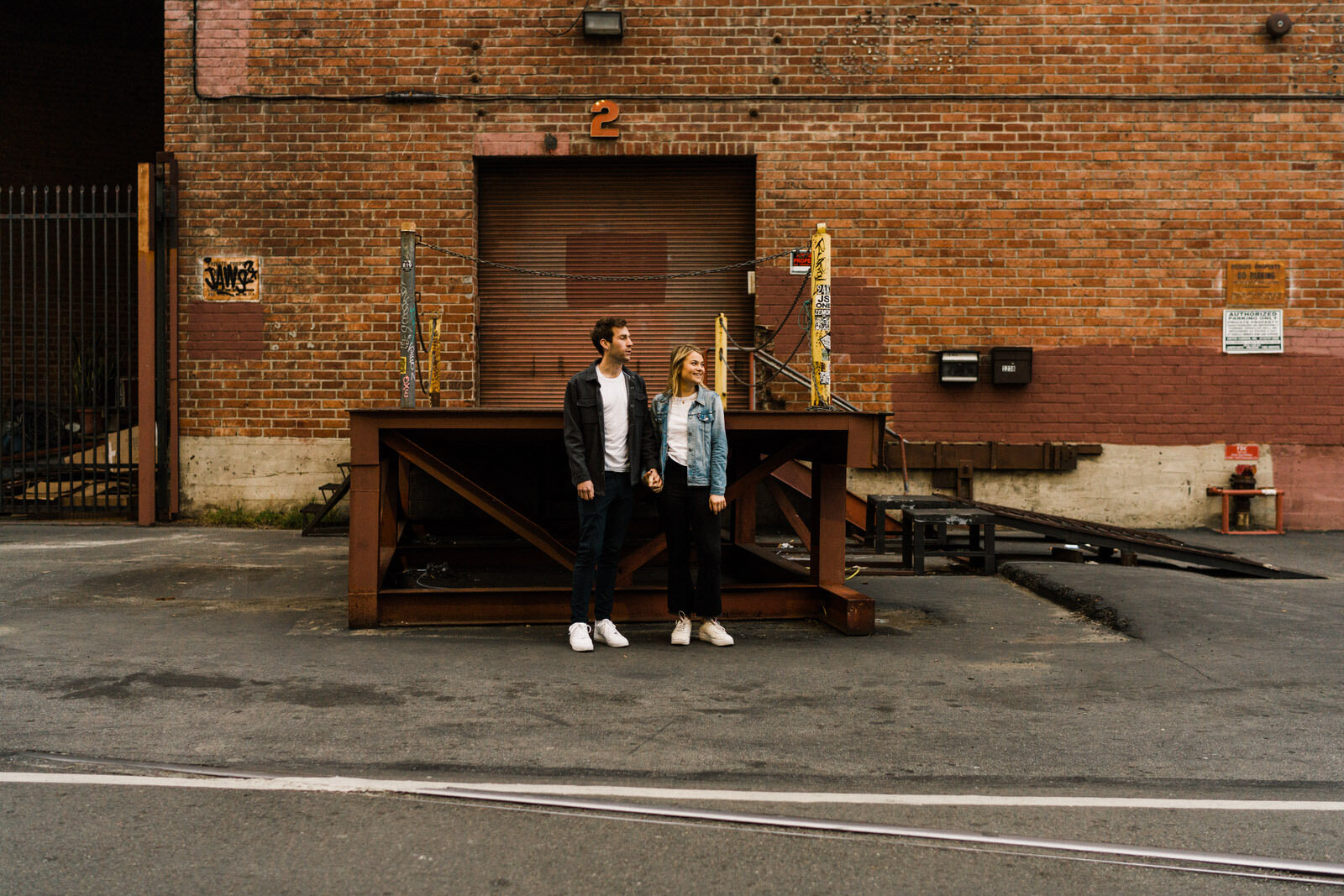 Dark and moody sunrise engagement photos in the LA Arts District | Fun, edgy, urban couples photos | Downtown LA Engagement photos | Photo by Kept Record | www.keptrecord.com