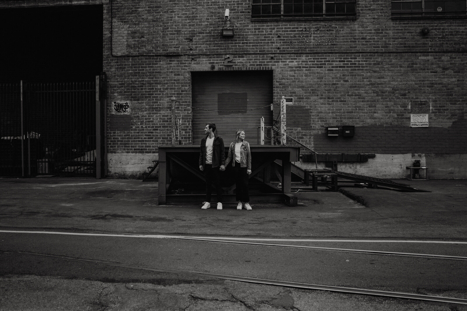 Dark and moody sunrise engagement photos in the LA Arts District | Fun, edgy, urban couples photos | Downtown LA Engagement photos | Photo by Kept Record | www.keptrecord.com