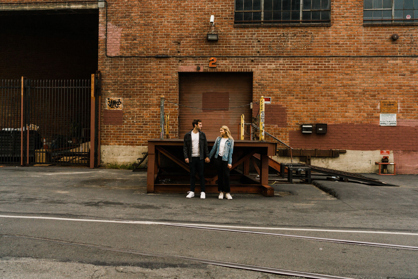 Dark and moody sunrise engagement photos in the LA Arts District | Fun, edgy, urban couples photos | Downtown LA Engagement photos | Photo by Kept Record | www.keptrecord.com