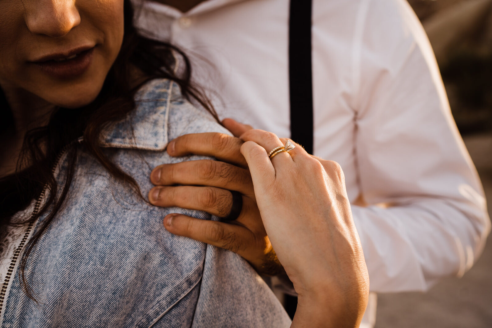 Closeup photo of bride and groom's hands in Joshua Tree National Park elopement at sunset | photo by Kept Record | www.keptrecord.com