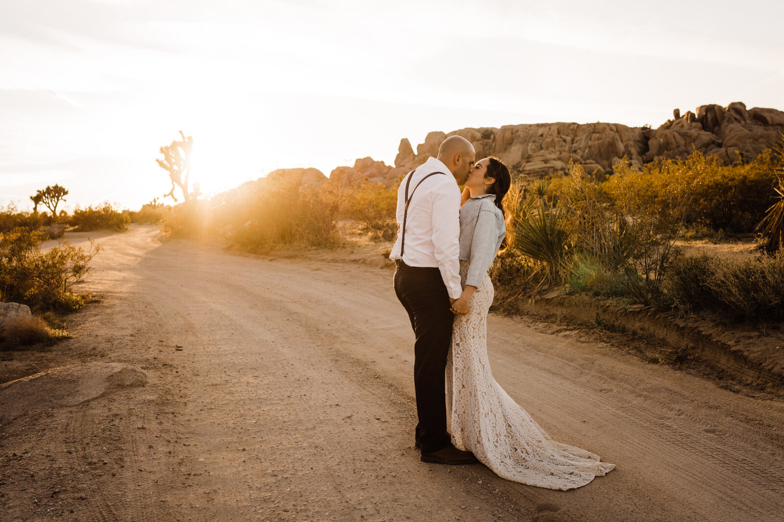 Eloping bride and groom kiss in Joshua Tree National Park at sunset | photo by Kept Record | www.keptrecord.com