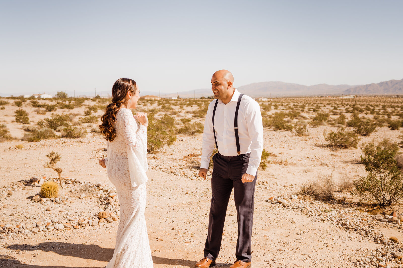 Emotional first look outside Cactus Mountain Retreat airbnb with bride and groom | photo by Kept Record | www.keptrecord.com