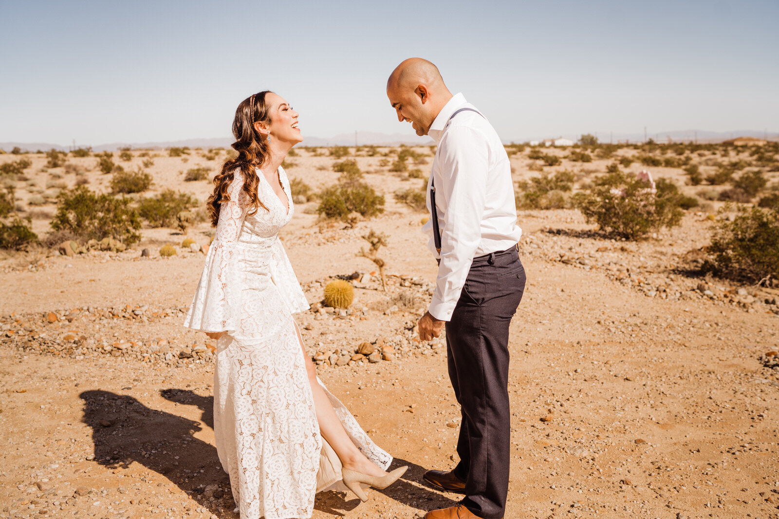 Bride and groom laugh during first look in Joshua Tree | photo by Kept Record | www.keptrecord.com