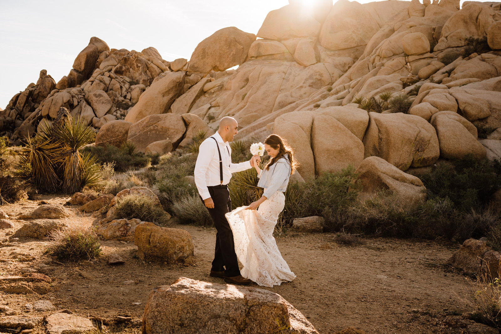 Mexican bride and groom dance the salsa at Live Oak Picnic Area in Joshua Tree National Park | adventurous, fun, warm wedding photos by Kept Record | www.keptrecord.com