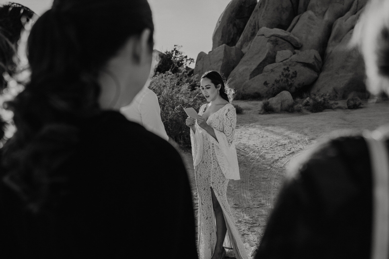 black and white photo of bride during Joshua Tree elopement ceremony | adventurous, fun, warm wedding photos by Kept Record | www.keptrecord.com