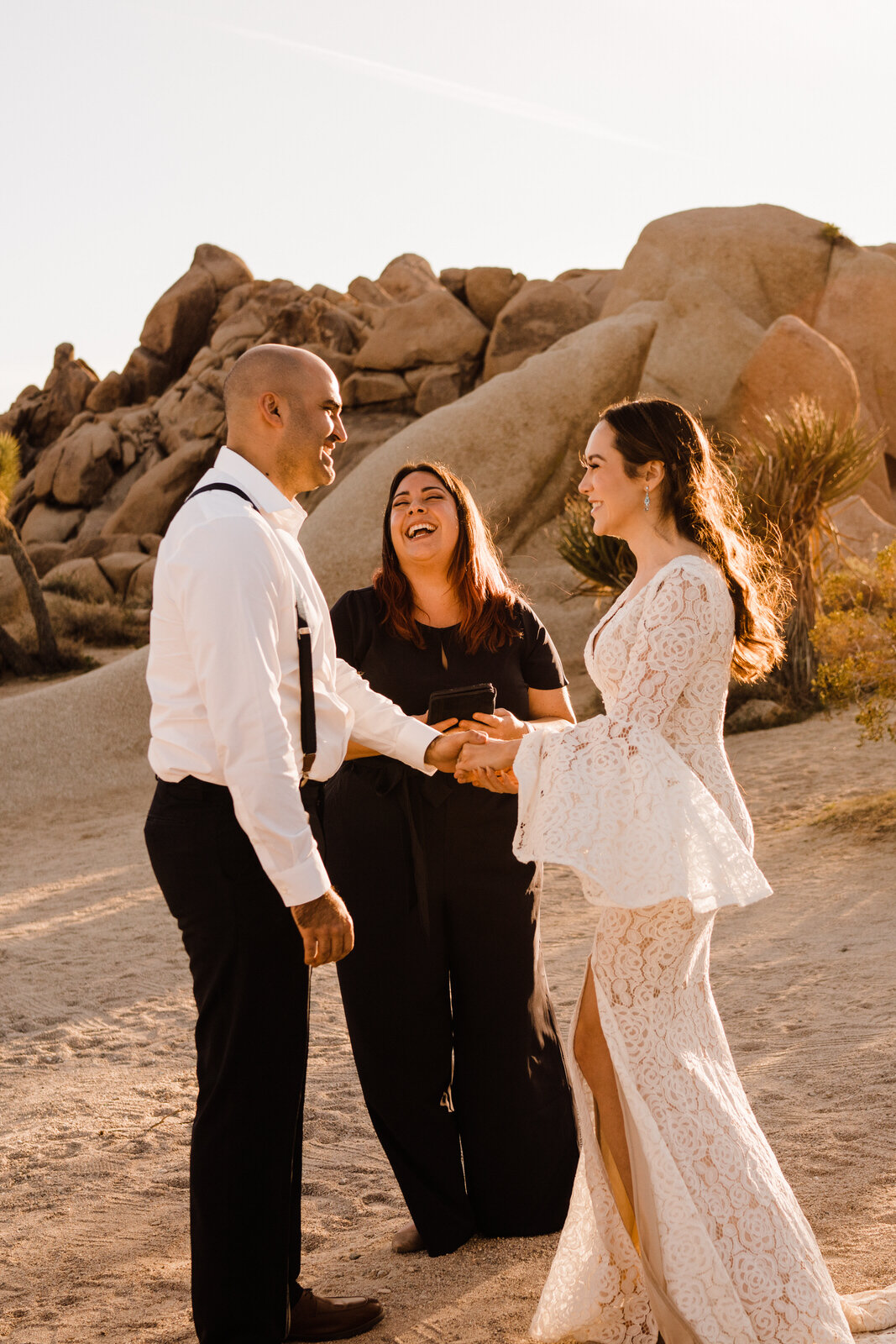 Officiant laughs with bride and groom during elopement ceremony | adventurous, fun, warm wedding photos by Kept Record | www.keptrecord.com