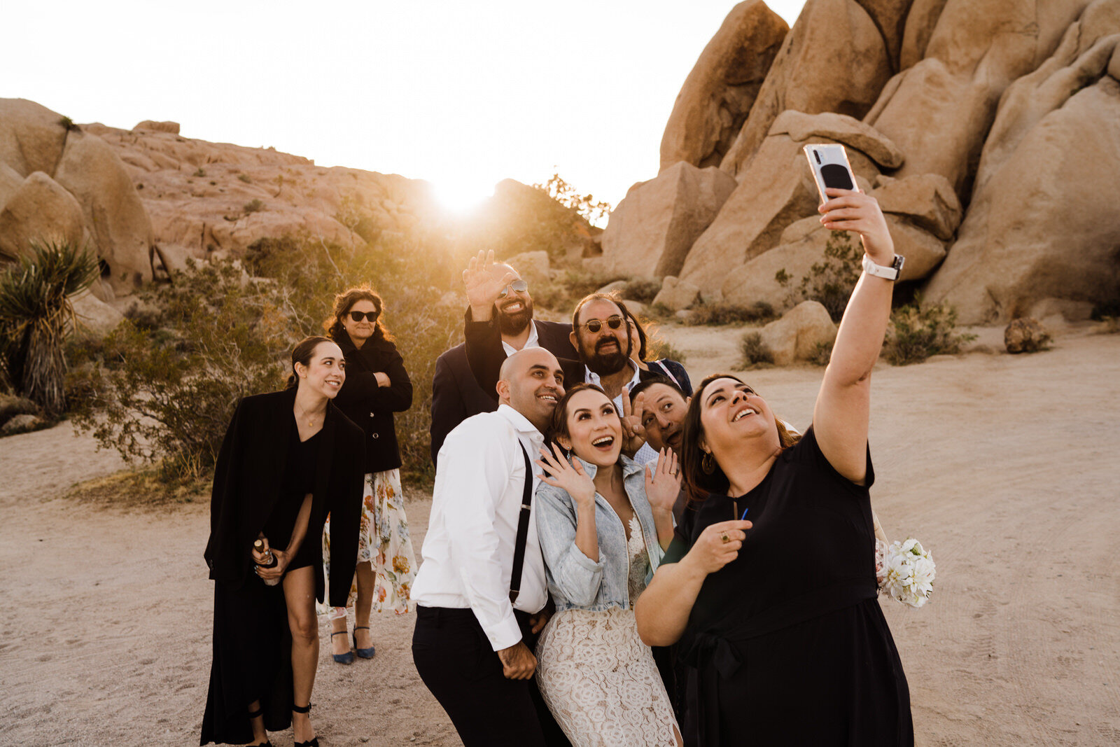group selfie with elopement officiant Marie Burns Holzer and family after Joshua Tree National Park ceremony | adventurous, fun, warm wedding photos by Kept Record | www.keptrecord.com