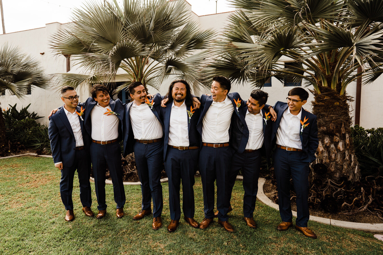 Fun, warm photos of groom with groomsmen at Ole Hanson Beach Club before wedding