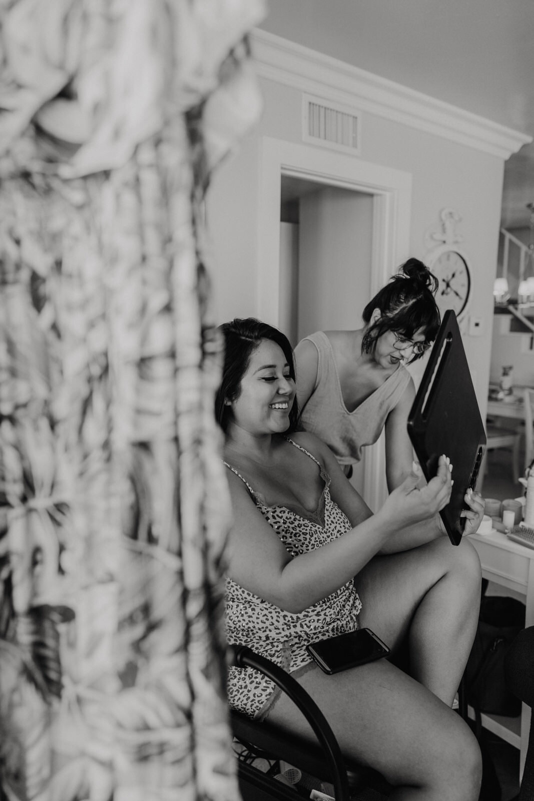 black and white photo of bride getting ready with Mindy Tidwell from Bows and Arrow Hair