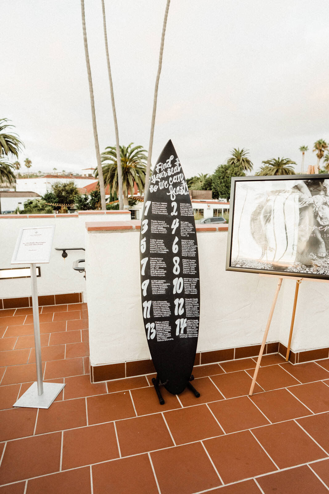 Surfboard Seating Chart at Hawaiian inspired San Clemente wedding at Ole Hanson Beach Club