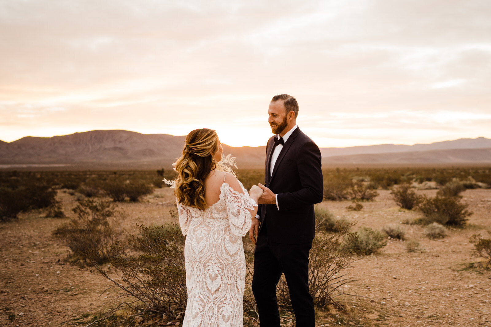 Las-Vegas-Wedding-Seven-Magic-Mountains-First-Look-Grooms-Reaction-Seeing-Bride-With-Mountains.JPG