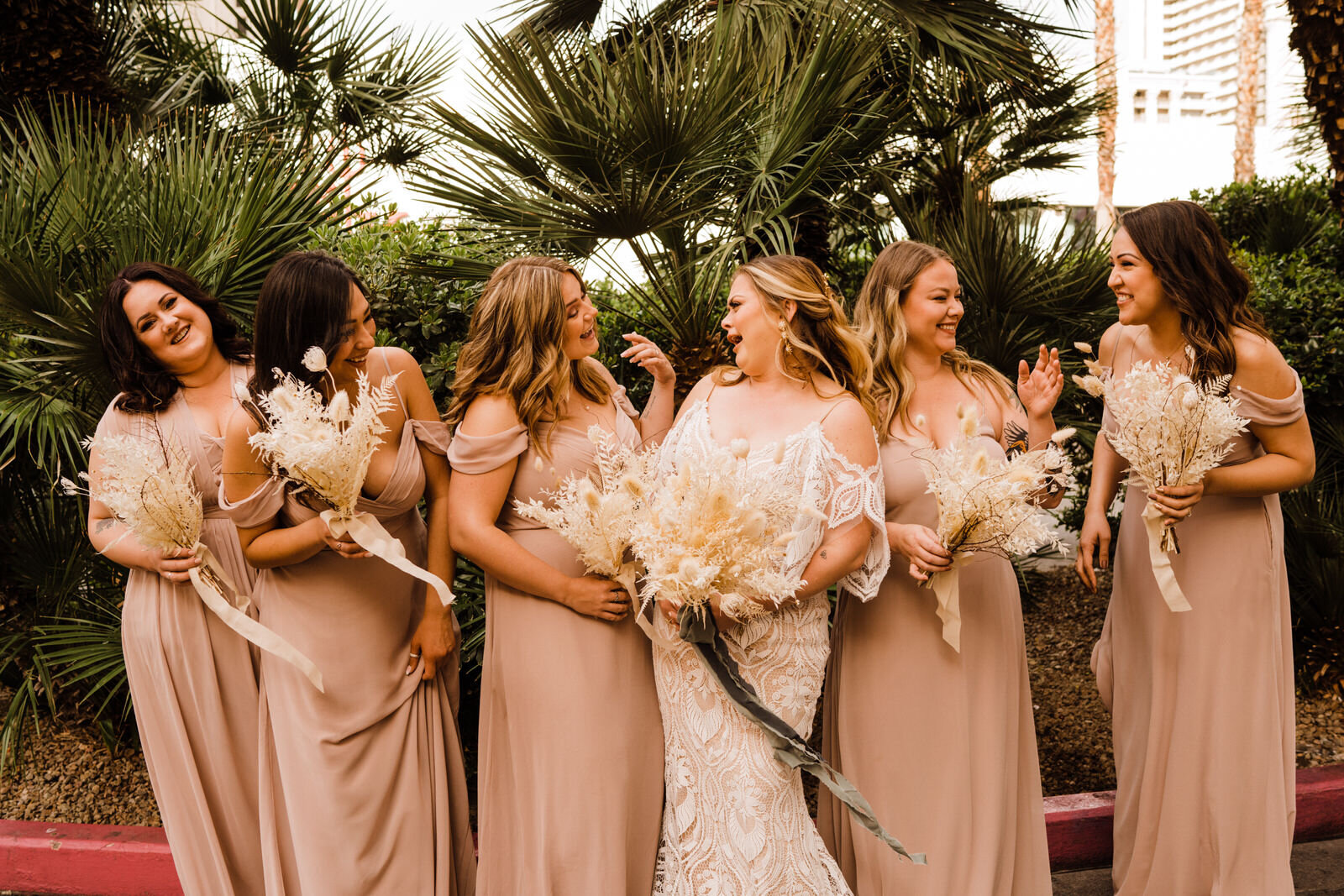 Bride and bridesmaids laugh at destination wedding in Las Vegas, Nevada