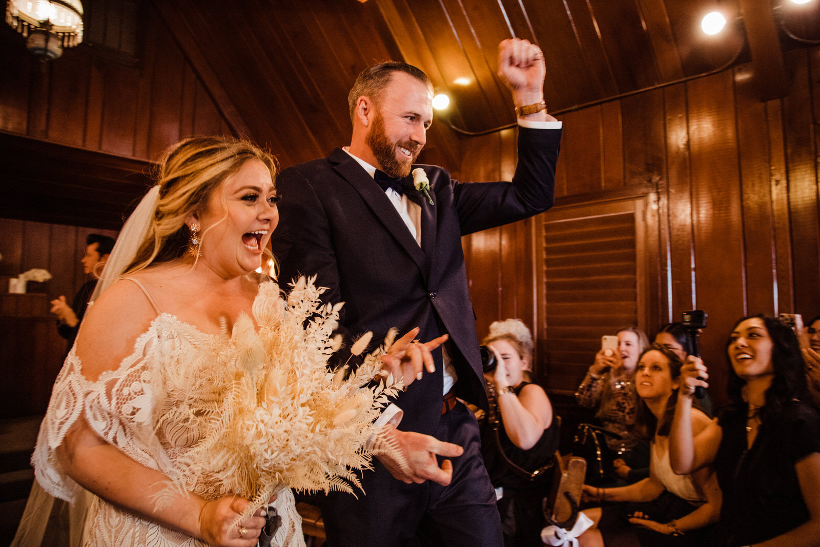 Bride and Groom cheer at Little Church of the West Wedding Chapel as they exit