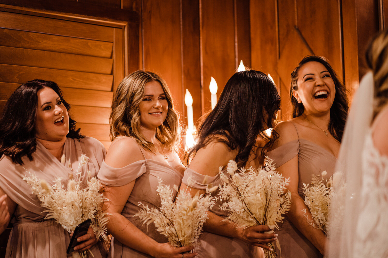 Bridesmaids candid laugh during ceremony at Little Church of the West in Las Vegas