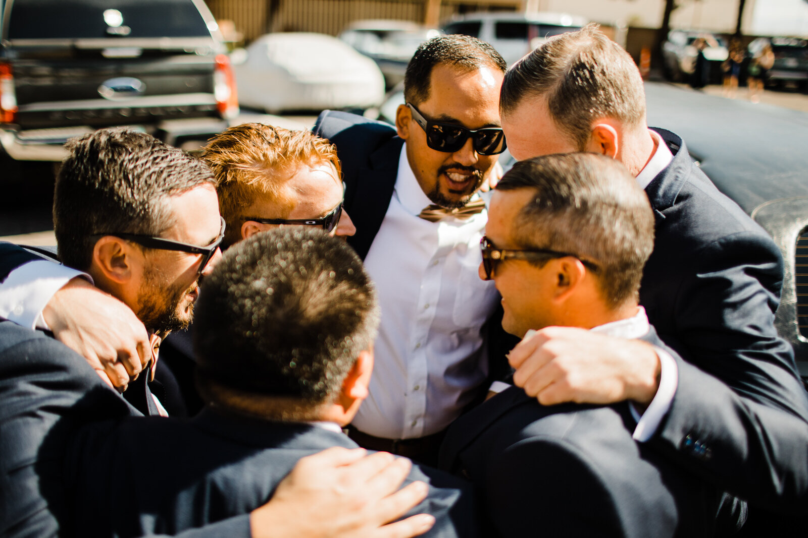 Groomsmen huddle before wedding at Little Church of the West Las Vegas wedding chapel