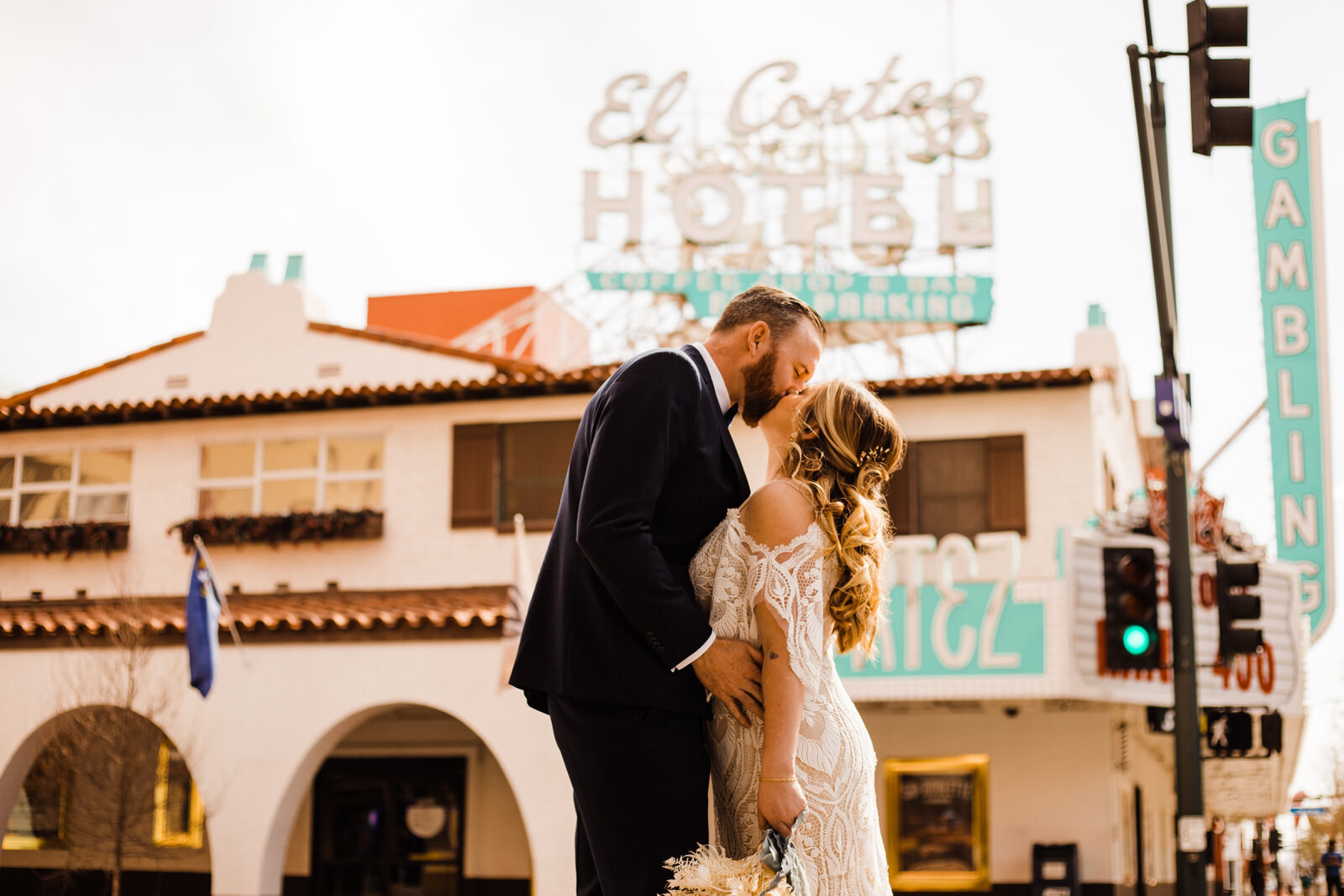 Bride and Groom kiss in front of El Cortez Hotel on East Fremont Street in Las Vegas, NV