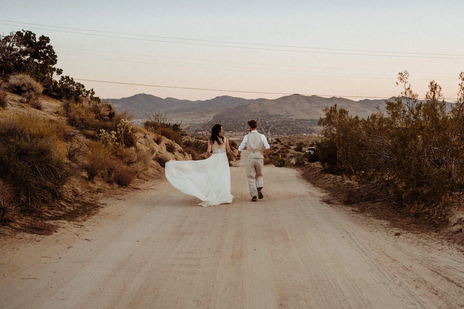 Joshua-Tree-Elopement-Couple-Running-Sunset.jpg