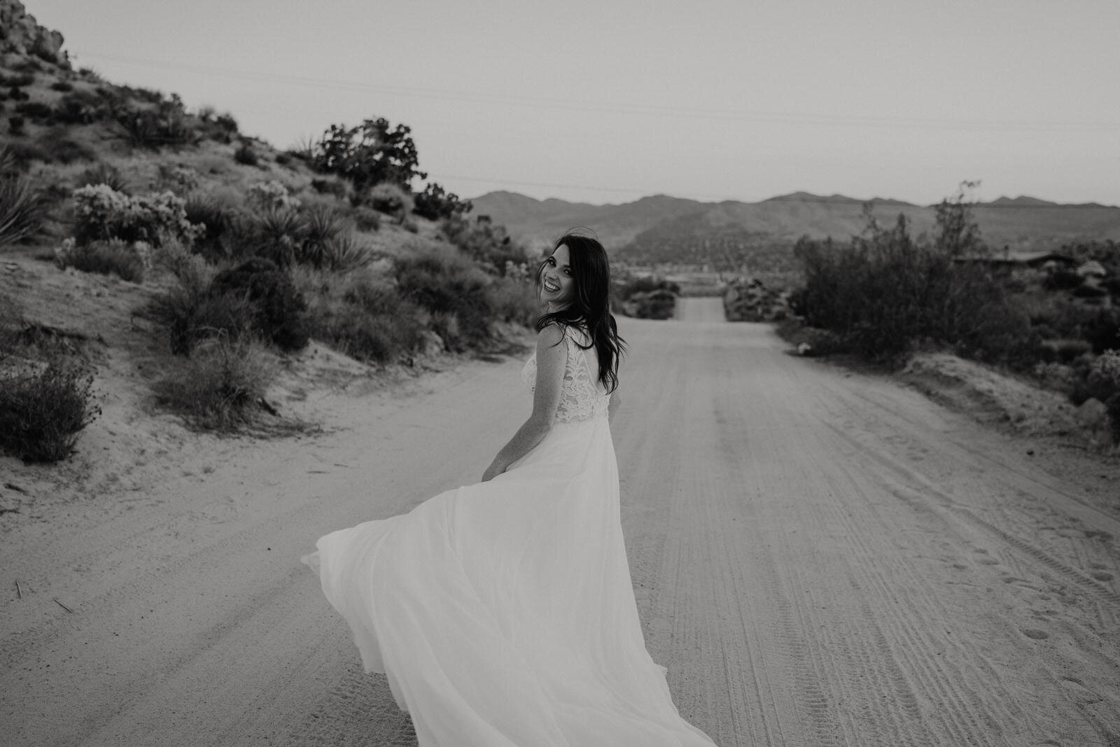 Joshua-Tree-Elope-Bride-on-Dirt-Road.jpg