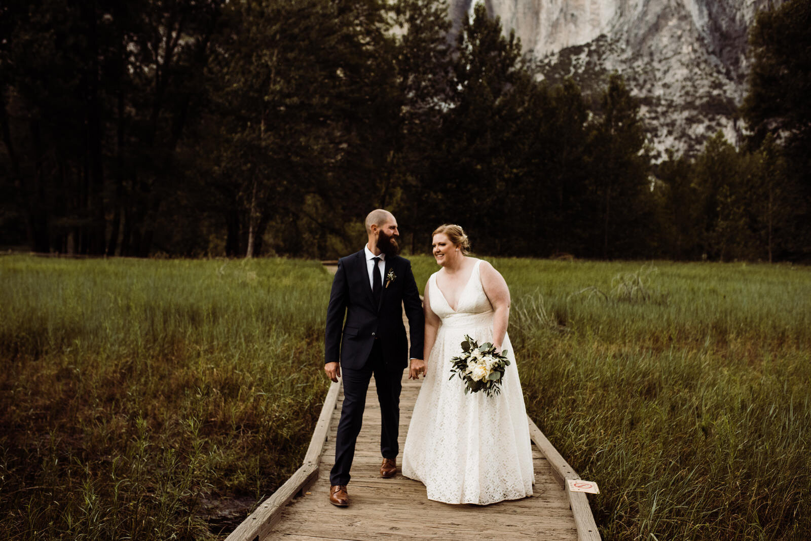 Glacier-Point-Yosemite-Elopement-Bride-and-Groom-on-Boardwalk-in-Yosemite-Valley.jpg