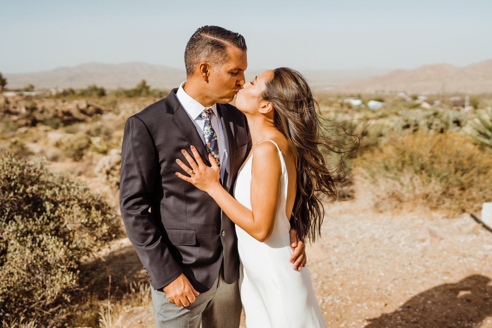 Eloping bride and groom kiss at Joshua Tree airbnb | fun, nontraditional wedding photos by California Elopement Photographer Planner Kept Record | www.keptrecord.com