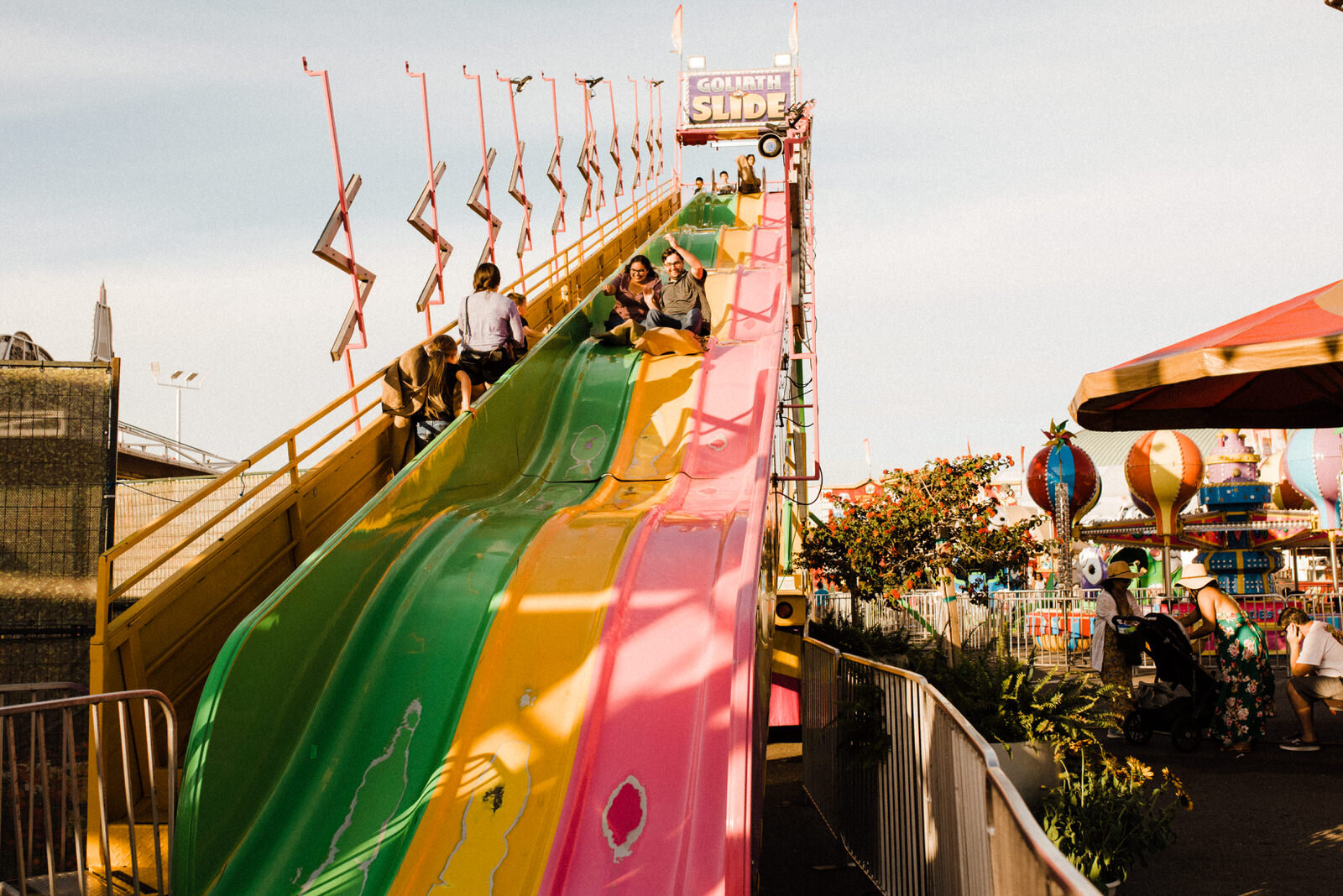 Unconventional engagement photo on fair slide | OC Fair engagement | fun, nontraditional wedding photos by California Elopement Photographer Planner Kept Record | www.keptrecord.com