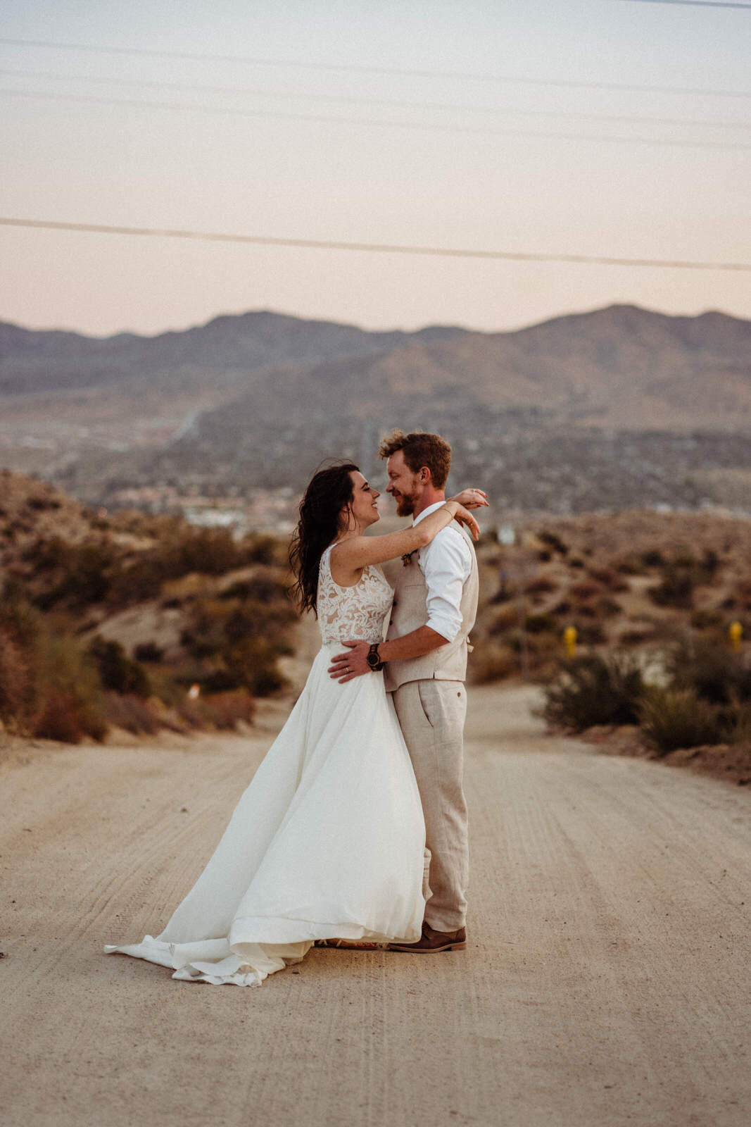 Joshua Tree elopement bride and groom dance in the desert | fun, nontraditional wedding photos by California Elopement Photographer Planner Kept Record | www.keptrecord.com