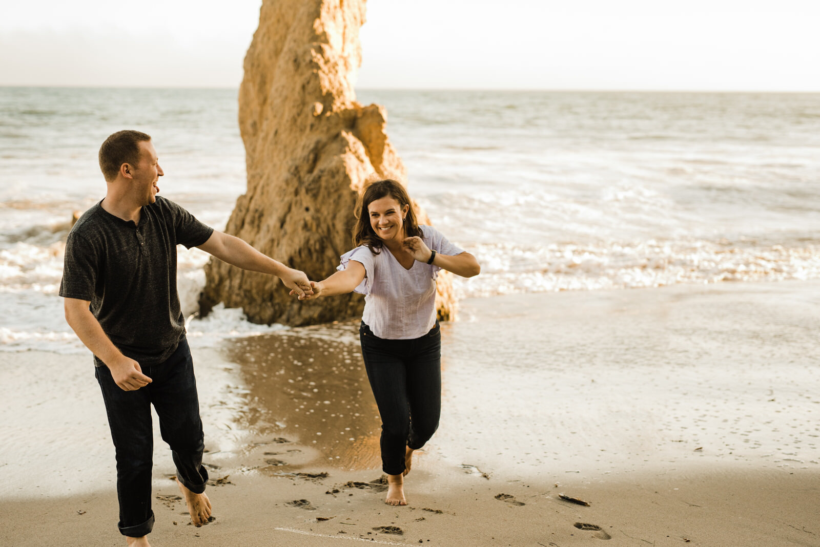 Happy, goofy beach engagement photo | fun, nontraditional wedding photos by California Elopement Photographer Planner Kept Record | www.keptrecord.com