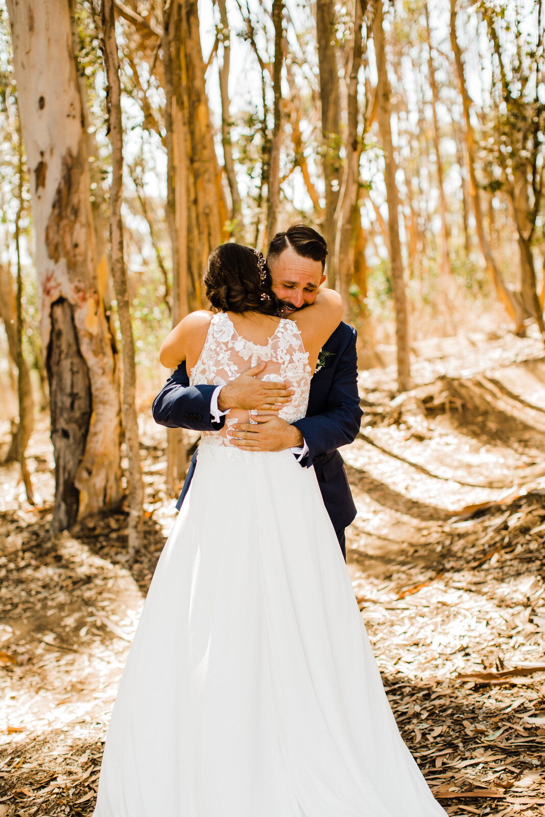 Emotional groom hugs bride at first look in Ventura wedding | fun, nontraditional wedding photos by California Elopement Photographer Planner Kept Record | www.keptrecord.com