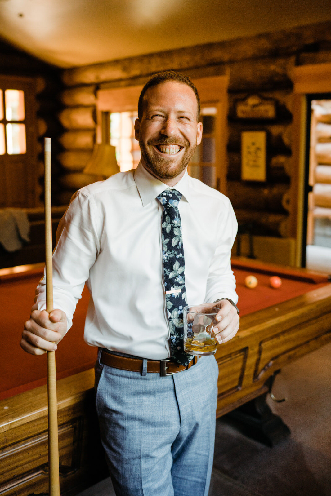 Groom with whiskey plays pool in Napa cabin | fun, nontraditional wedding photos by California Elopement Photographer Planner Kept Record | www.keptrecord.com