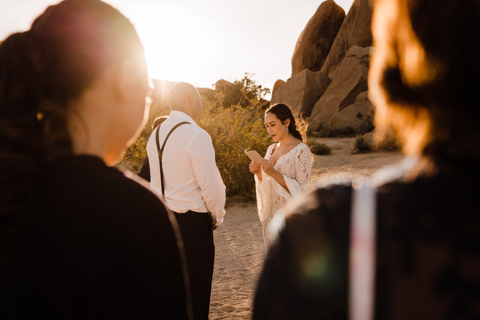 bride-reads-vows-at-joshua-tree-national-park-elopement-ceremony-at-live-oak-picnic-area.jpg
