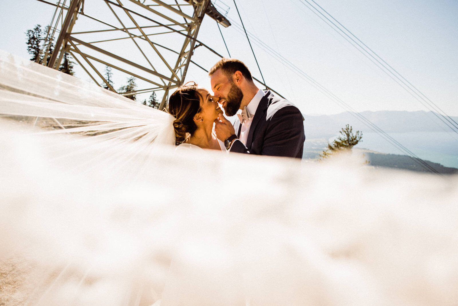 Bride and Groom kiss by Ski Gondola with Veil in the Wind | Kept Record | www.keptrecord.com