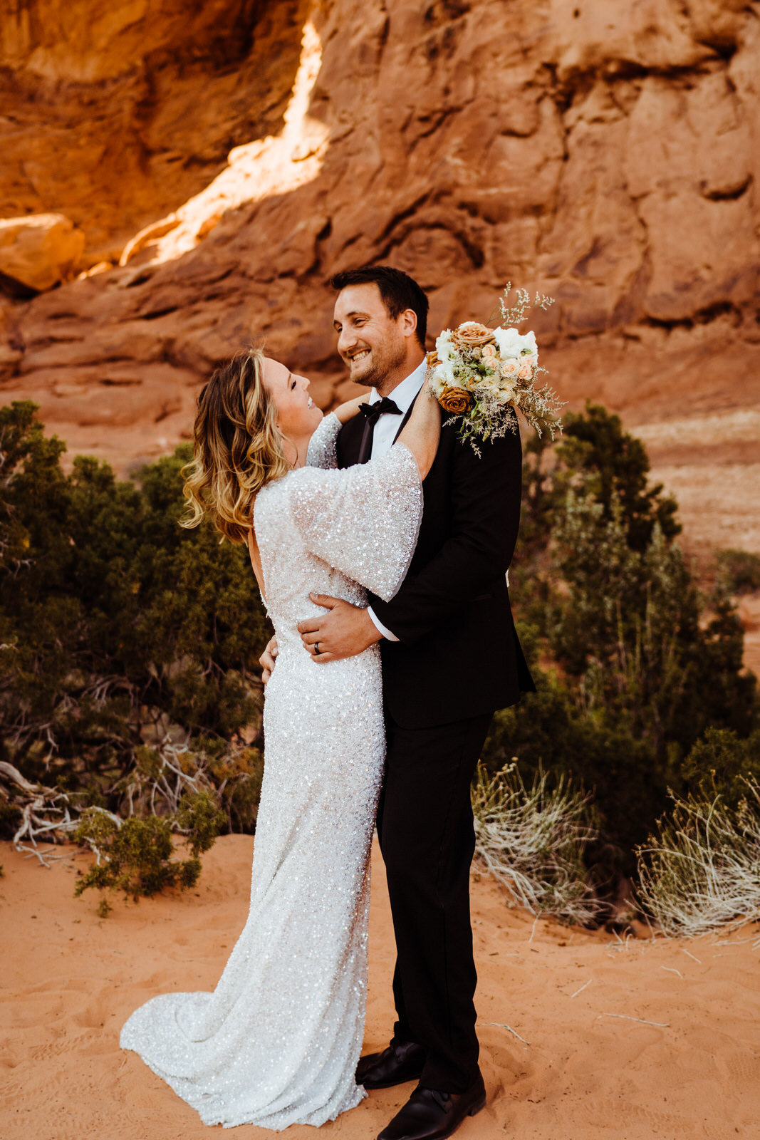 Arches-National-Park-Wedding-Glamorous-Bride-and-Groom-on-Trail (2).jpg
