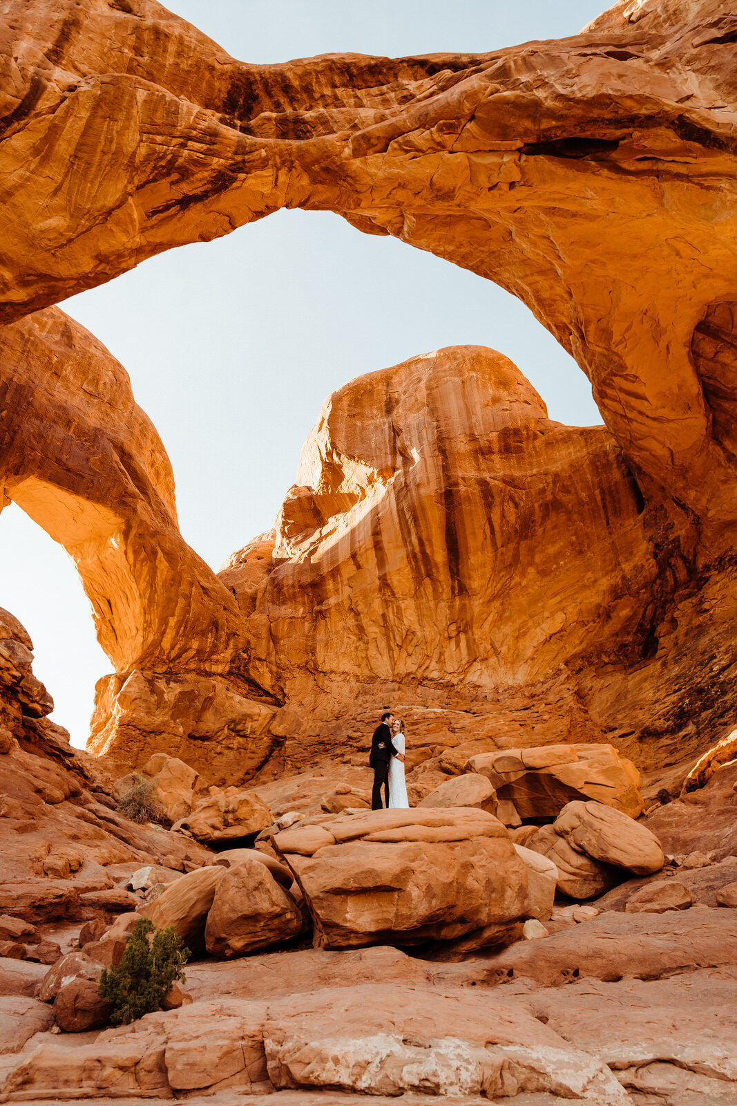Arches-National-Park-Wedding-couple-on-rock-at-sunset.jpg