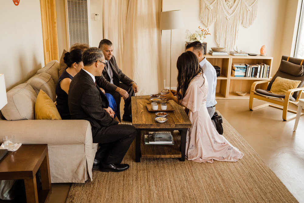 Joshua-Tree-Chinese-Tea-Ceremony-Wedding-Bride-and-Groom-Serve-Tea-to-Parents (5).jpg