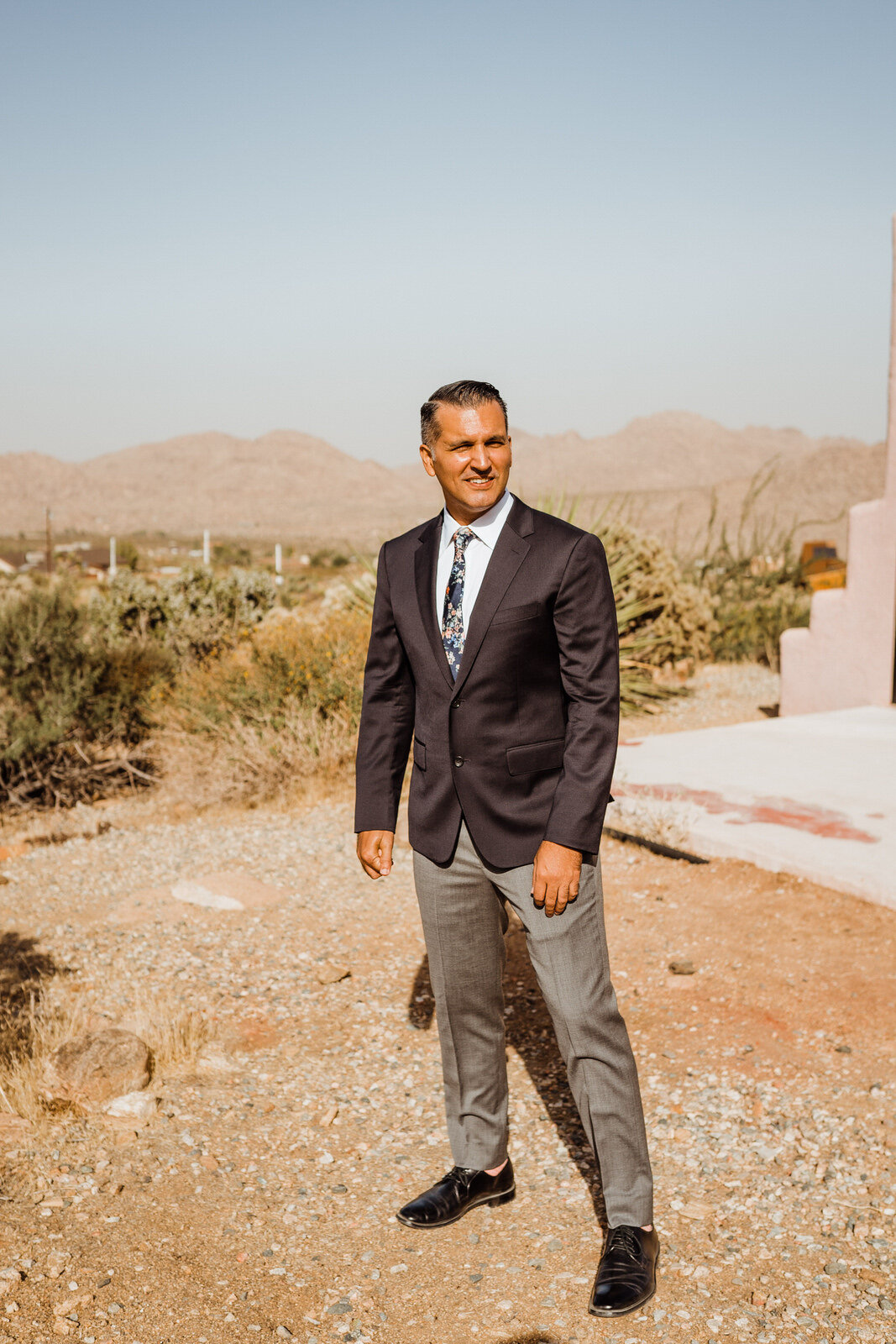Groom Stands Waiting for Bride at Joshua Tree Wedding First Look 