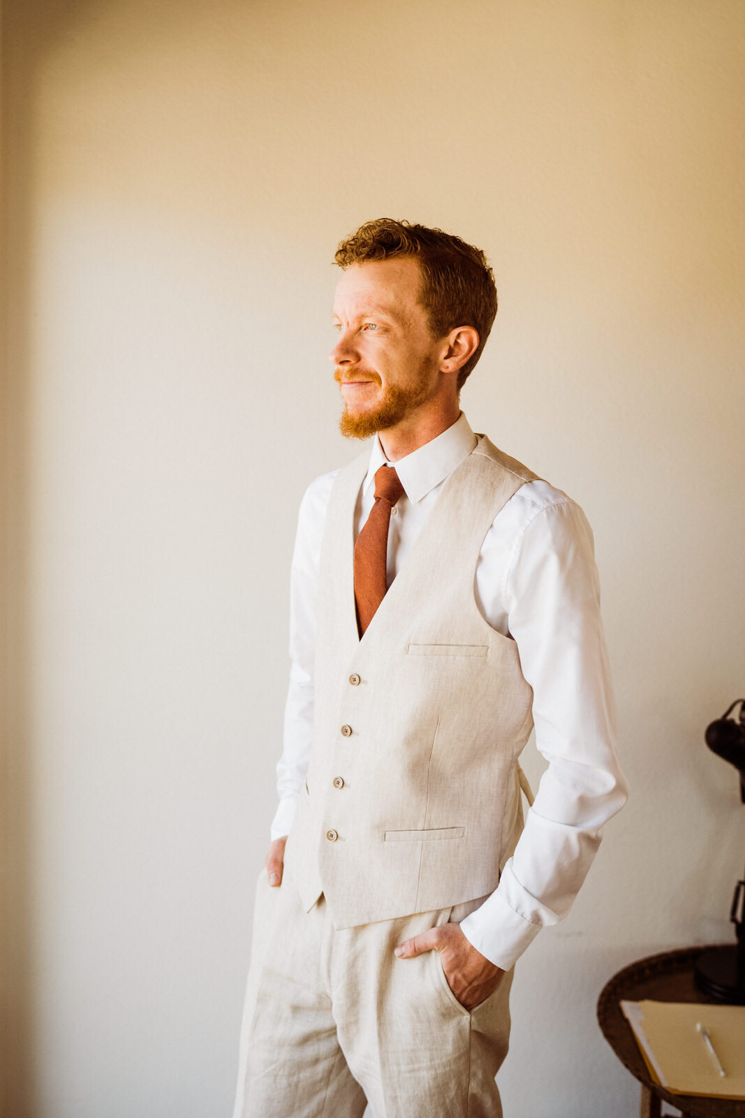 Fall-Wedding-in-Joshua-Tree-Groom-in-Tan-Suit-Getting-Ready-with-Star-Wars-Cufflinks (4).jpg