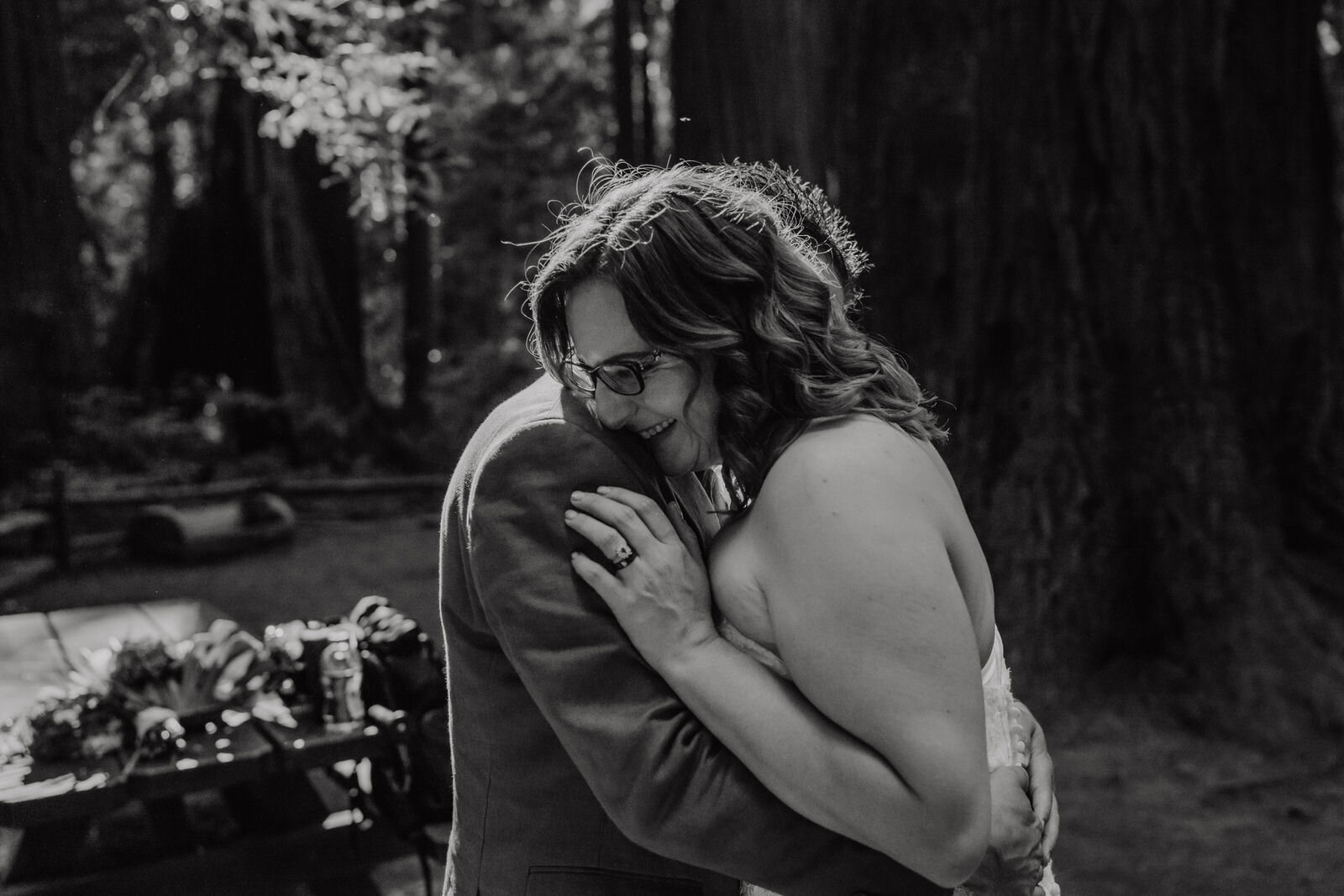 Henry-Cowell-Redwoods-State-Park-Wedding-Santa-Cruz-Black-and-White-Photo-of-Smiling-Bride-in-Glasses.jpg