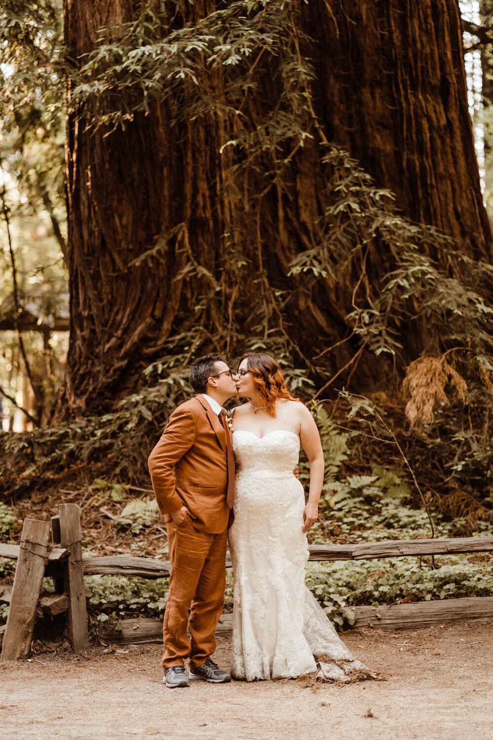 Henry-Cowell-Redwoods-State-Park-Wedding-Santa-Cruz-Couple-Kissing-Beneath-Massive-Tree.jpg