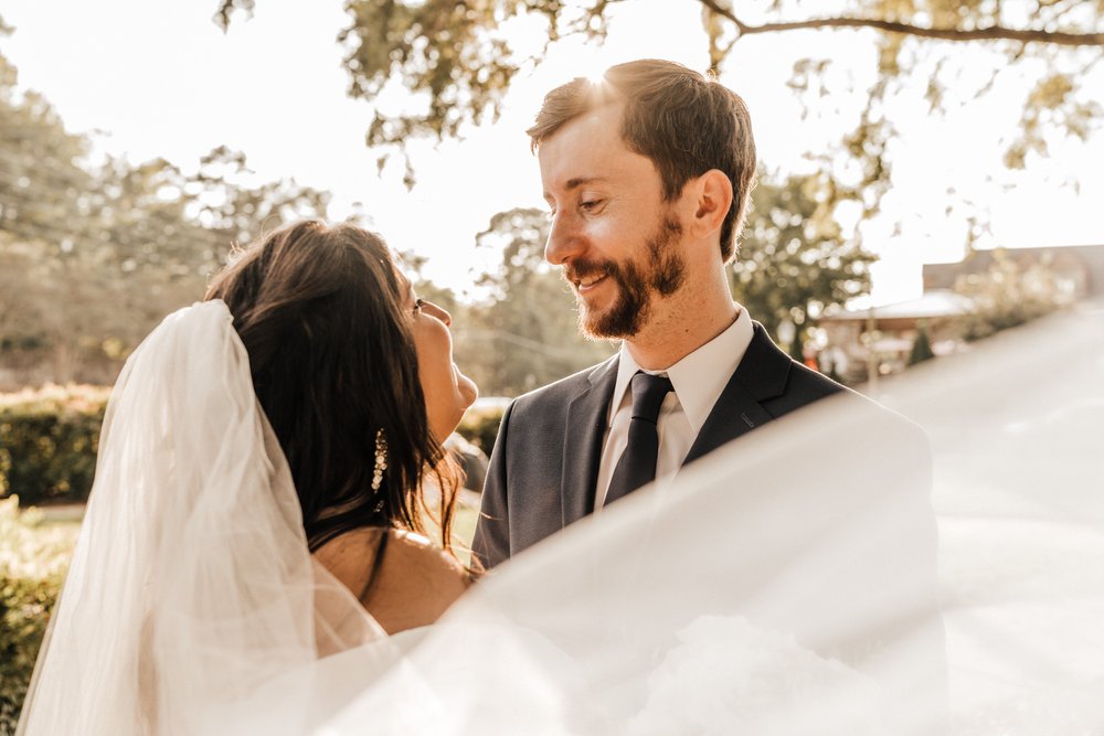 Georgia-Wedding-Bride-and-Groom-with-veil-at-Roswell-Town-Square (3).jpg